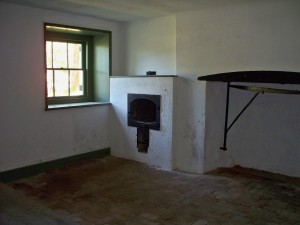 The oven and stove fireplace in the ground level basement kitchen.